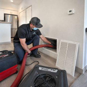 On the Spot Restoration technician cleaning air duct system