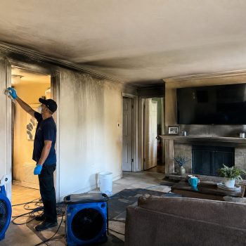 Restoration specialist repairing fire-damaged area of Florida home